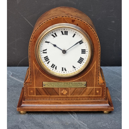 1386 - An early 20th century mahogany and inlaid mantel timepiece, 18cm high, (repairs to dial). ... 