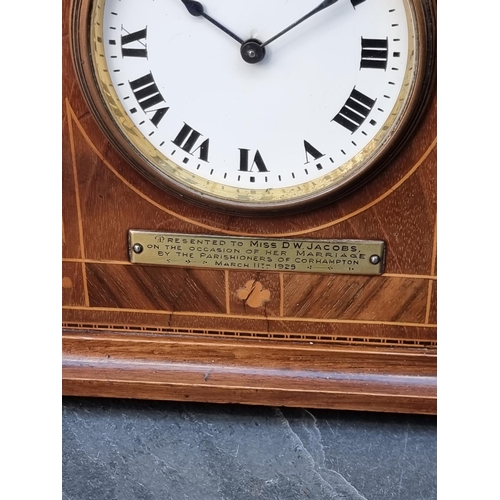 1386 - An early 20th century mahogany and inlaid mantel timepiece, 18cm high, (repairs to dial). ... 