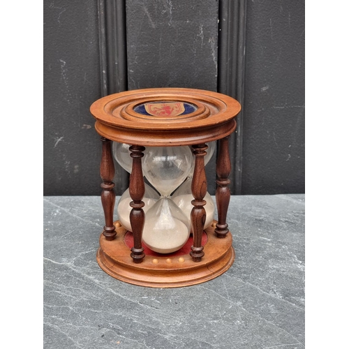 1387 - An unusual mahogany triple egg timer, 14cm high. 