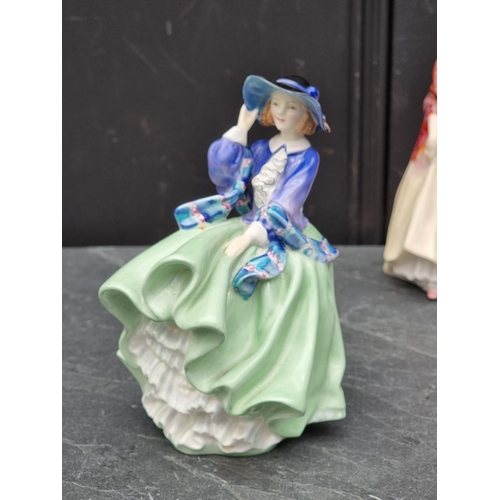 1399 - Three Royal Doulton figures, comprising 'Paisley Shawl', HN1987; 'Top o' the Hill', HN1833; and 'Lin... 