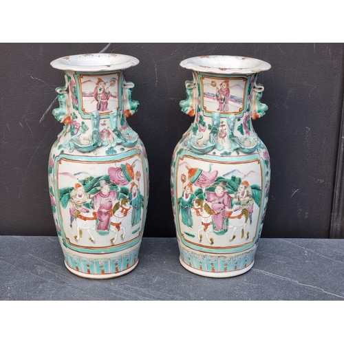 1420 - A pair of Chinese famille rose twin handled vases, 25cm high.