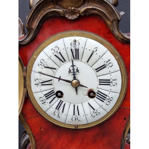 1441 - A Louis XV style tortoiseshell mantel clock, 39.5cm high, with pendulum.