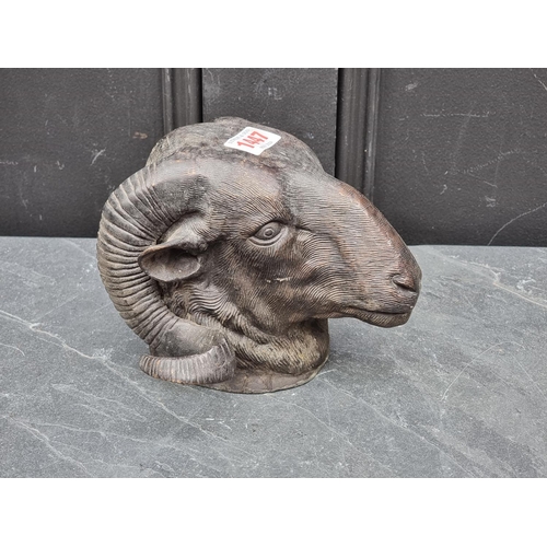 1447 - A bronze ram's head, 14cm high.