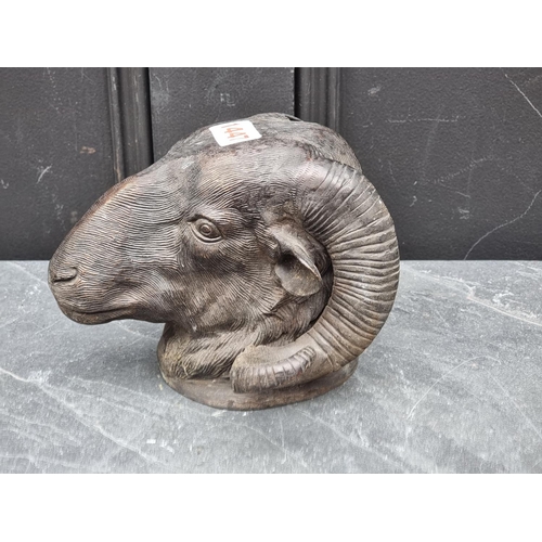 1447 - A bronze ram's head, 14cm high.