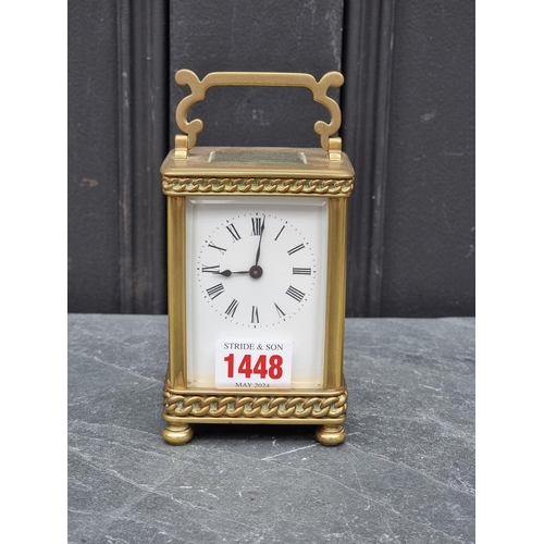 1448 - An old brass carriage timepiece, height including handle 15cm. 