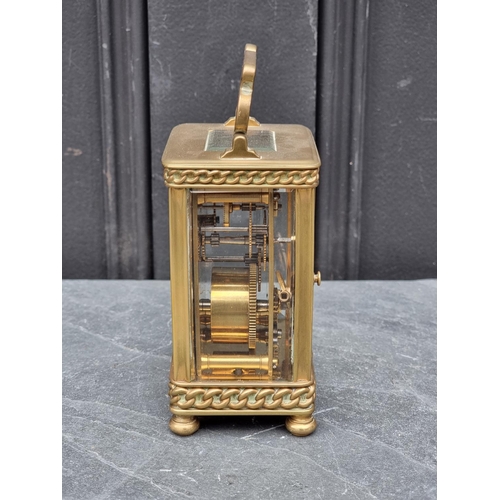 1448 - An old brass carriage timepiece, height including handle 15cm. 