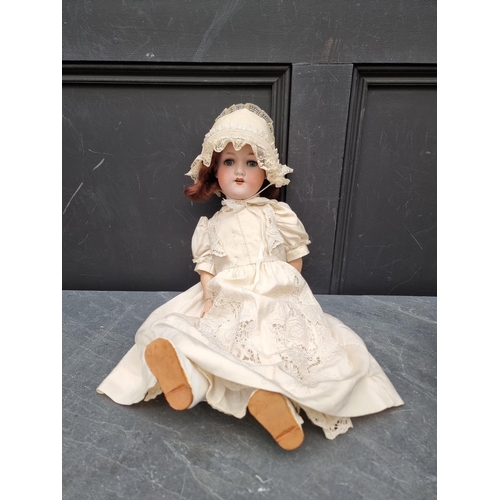 1459 - Dolls: an Armand Marseille 390 doll; together with another German bisque head doll. (2)... 