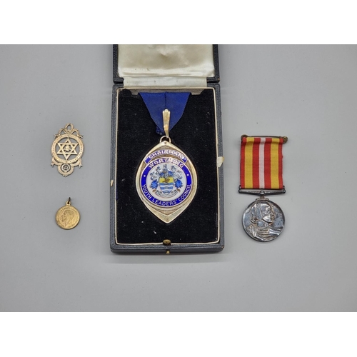 1477 - Medals: a Voluntary Medical Service Medal, to Miss Eileen A M Brake; together with a large silver an... 