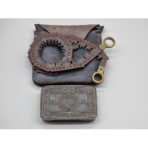 1484 - A WWI Christmas 1914 brass tin; together with a similar leather cased trench saw. (2)... 