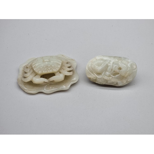 1490 - A good Chinese carved pale celadon crab and lily pad, 8.2cm wide; together with another similar drag... 