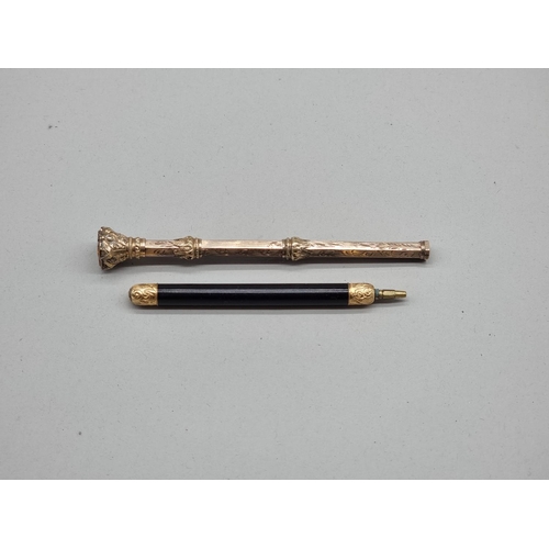 1496 - A Victorian gold plated combination propelling dip pen and pencil, 10.3cm when closed; together with... 