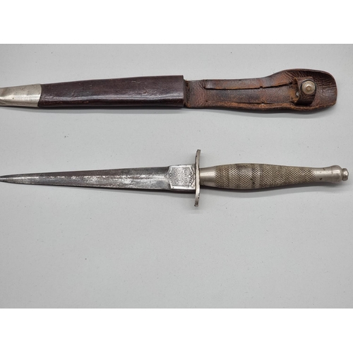 1500 - A rare circa 1940 Fairbairn-Sykes first pattern commando fighting knife and leather sheath, by Wilki... 