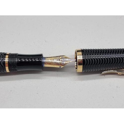 1501 - A Montblanc limited edition 'Virginia Woolf' fountain pen, boxed, together with a Montblanc ink bott... 