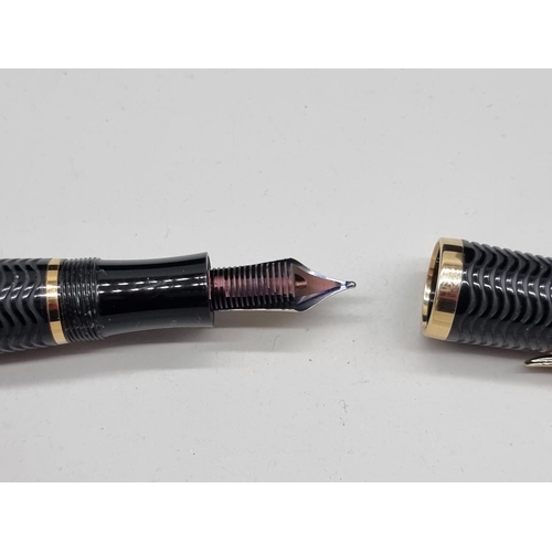 1501 - A Montblanc limited edition 'Virginia Woolf' fountain pen, boxed, together with a Montblanc ink bott... 