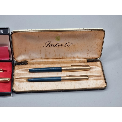 1502 - A group of vintage pens, comprising: a cased Parker silver pen set, circa 1964, (s.d. to one); a Par... 