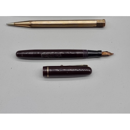 1508 - A Mabie Todd 'Swan' fountain pen, with 14ct nib; together with a gilt metal propelling pencil, in vi... 