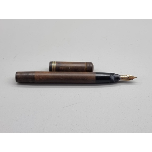 1511 - A vintage Ford brown and gilt metal fountain pen, the 14ct nib inscribed '428 Mill'.... 