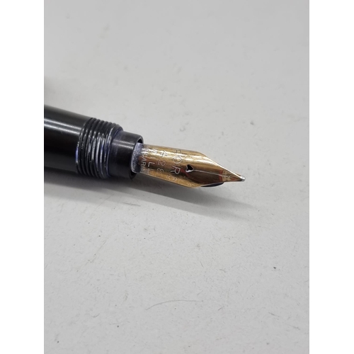 1511 - A vintage Ford brown and gilt metal fountain pen, the 14ct nib inscribed '428 Mill'.... 