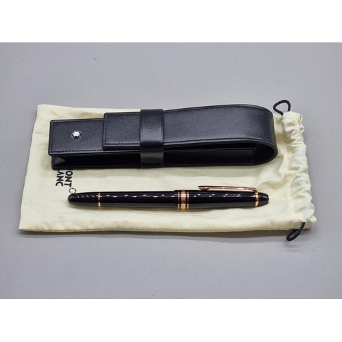 1516 - A Montblanc Meisterstuck 'Classique' gold coated fountain pen, with 14ct nib, in Montblanc black lea... 