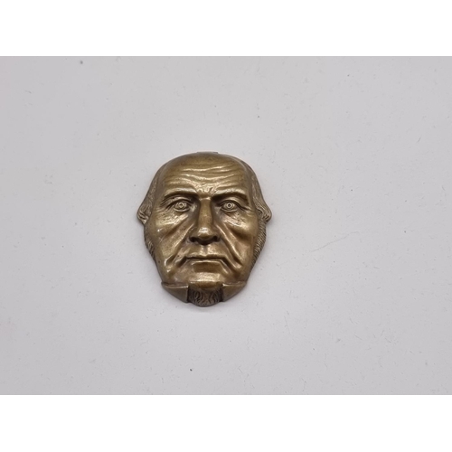 1529 - A Victorian brass novelty 'William Gladstone' vesta case, 5cm high. 