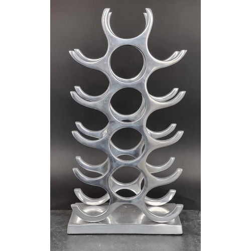 1548 - A Michael Noll aluminium sixteen bottle wine rack, 60cm high.