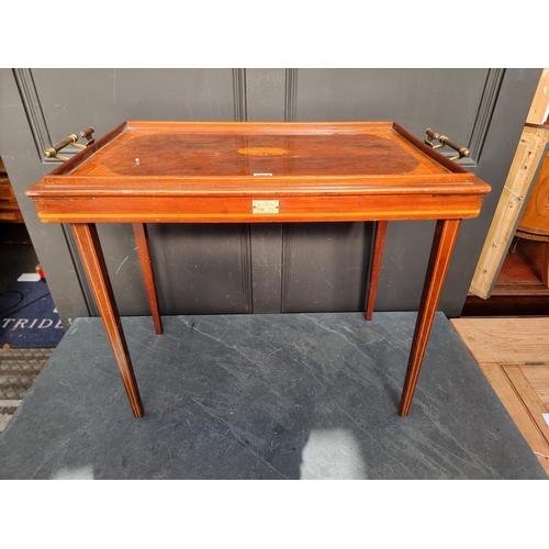 1068 - An Edwardian mahogany and inlaid folding table, bearing ivory plaque inscribed 'The Osterley Table T... 