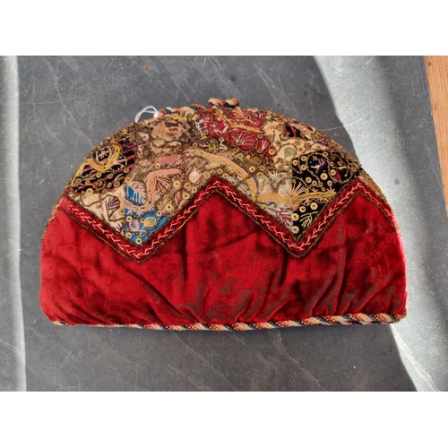 1344 - A Victorian embroidered tea cosy, 34cm wide.