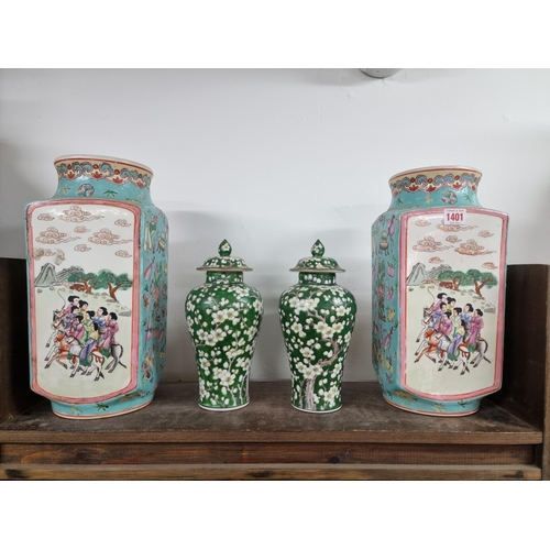 1401 - A large pair of Chinese famille rose vases, 36cm high; together with a pair of green ground prunus v... 