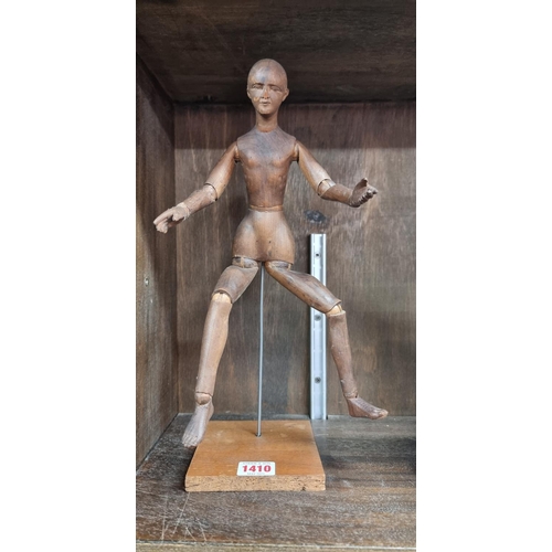 1410 - An antique beech artist's lay figure, 33.5cm high.