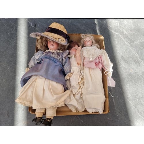 1461 - Dolls: a small Armand Marseille doll; together with two other small bisque head dolls. (3)... 