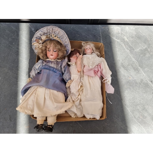 1461 - Dolls: a small Armand Marseille doll; together with two other small bisque head dolls. (3)... 