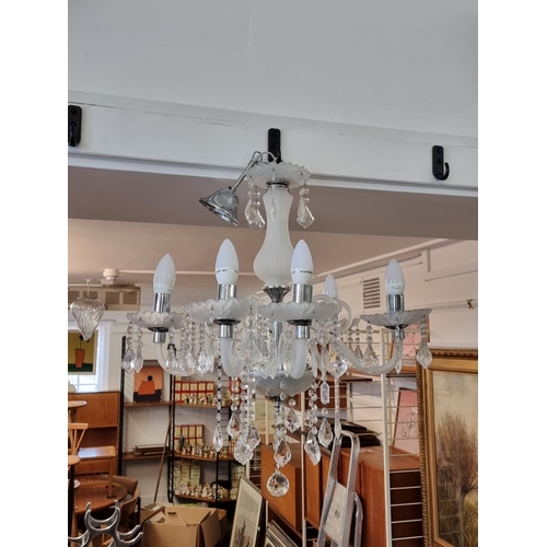 1583 - A contemporary frosted and faceted glass six branch chandelier, 64.5cm high.