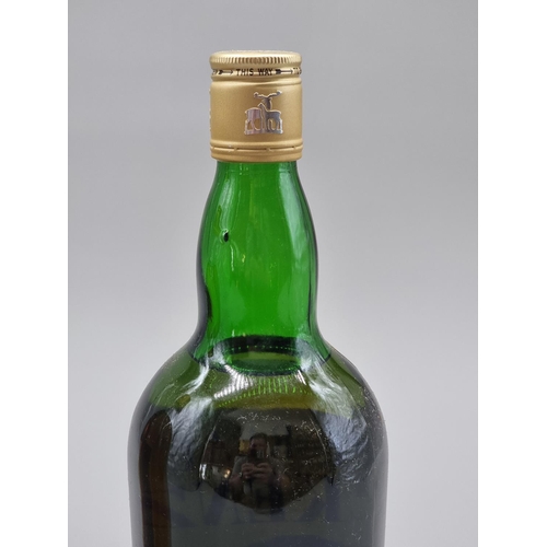 12 - Two old 1 litre bottles of blended Whisky, probably 1970s bottlings, comprising: The Real ... 