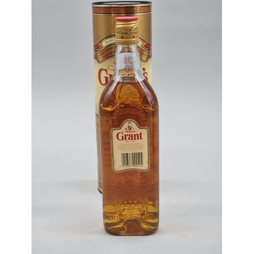 30 - A 1 litre bottle of Southern Comfort 'Reserve'; together with a 70cl bottle of Grant's blended Whisk... 