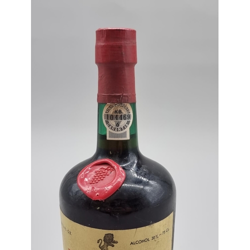 61 - A 26 2/3 fl.oz. bottle of Rocha's 1966 Ruby Port, bottled in 1976. 