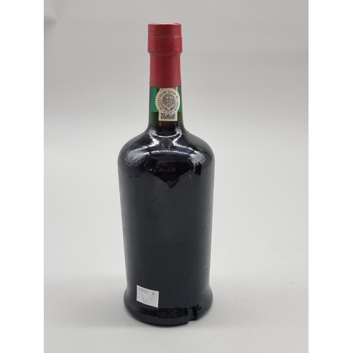 61 - A 26 2/3 fl.oz. bottle of Rocha's 1966 Ruby Port, bottled in 1976. 