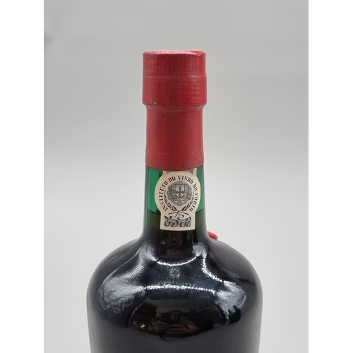 61 - A 26 2/3 fl.oz. bottle of Rocha's 1966 Ruby Port, bottled in 1976. 