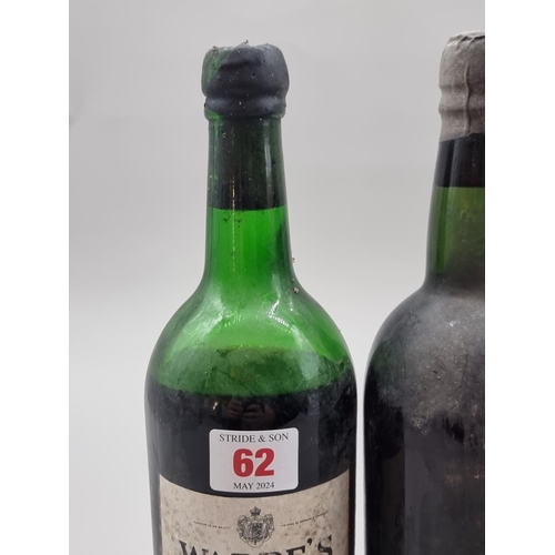 62 - A bottle of Warre's 1970 Vintage Port, (low shoulder level); together with another old bottle of Por... 