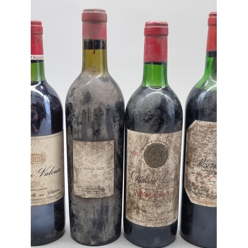 84 - An interesting group of French vintage red Wines, comprising: Chateau Palmier, Saint Estephe, 1982; ... 