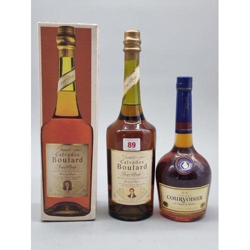 89 - A 1 litre bottle of Boulard Calvados Pays d'Auge, in card box; together with a 70cl bottle of Courvo... 