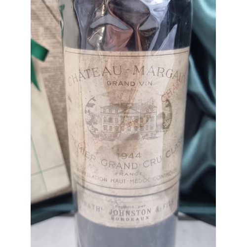 90 - A bottle of Chateau Margaux, 1944, in presentation box, with certification and The Times, September ... 