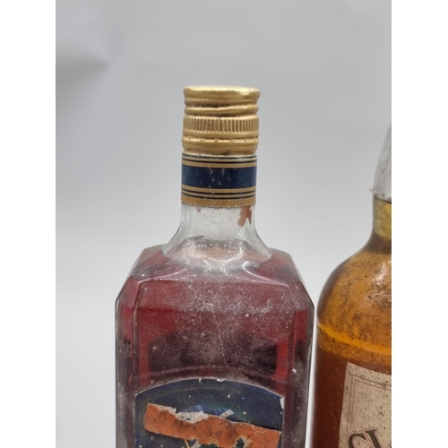 92 - Five bottles of blended whisky, comprising: an old 24 2/3 fl.oz. bottle of William Lawson's, probabl... 