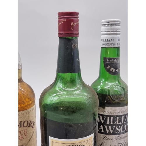 92 - Five bottles of blended whisky, comprising: an old 24 2/3 fl.oz. bottle of William Lawson's, probabl... 