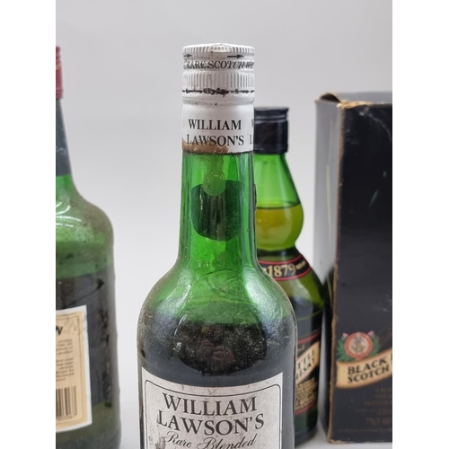 92 - Five bottles of blended whisky, comprising: an old 24 2/3 fl.oz. bottle of William Lawson's, probabl... 