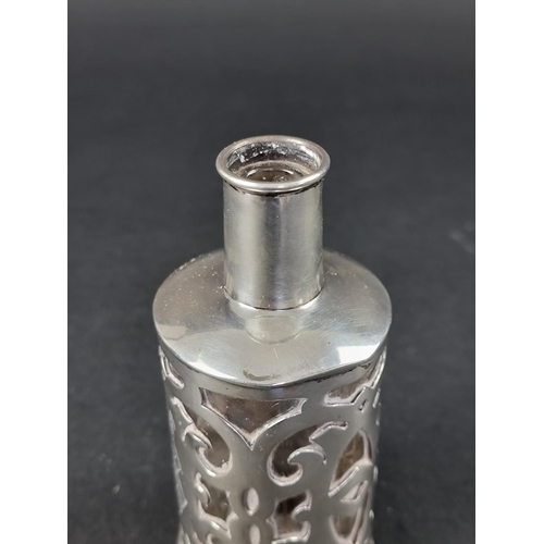 209 - A Continental white metal mounted scent bottle, stamped '800', 12cm high.