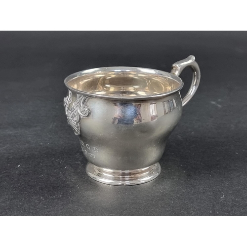 214 - An unmarked Continental metal cup, height to handle 7.5cm.
