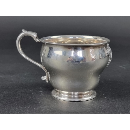 214 - An unmarked Continental metal cup, height to handle 7.5cm.