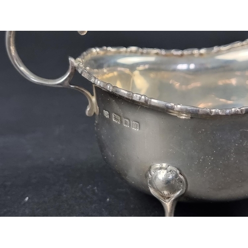 217 - A silver sauce boat, by Robert Pringle & Sons, London, 1928, height to handle 8cm, 125g.... 