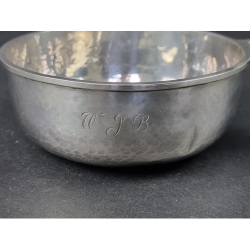 218 - A silver bowl, having single pierced handle, by A E Jones, Birmingham 1929, 16cm wide, 109g.... 