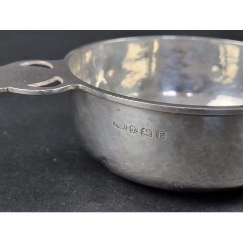 218 - A silver bowl, having single pierced handle, by A E Jones, Birmingham 1929, 16cm wide, 109g.... 